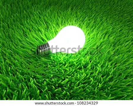 Glowing light bulb hanging above grass symbol of ecological energy