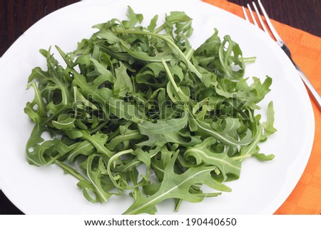 Rocket salad on white plate