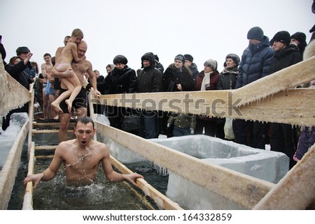 NOVOSIBIRSK, RUSSIA - JANUARY 19: Russian people celebrate Epiphany. Men, women and children come to the pond, January, 2009 in the Novosibirsk, Russia