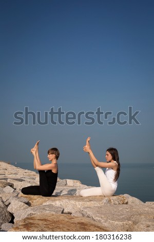 Yoga on the beach with sky background for text
