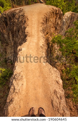 Dangerous narrow path over a cliff