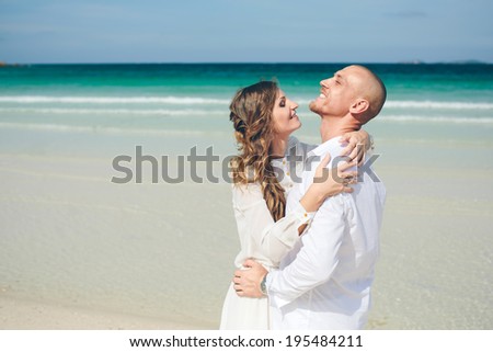 Beautiful woman and man in love on the sea