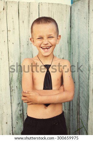 First Time to School, Funny Schoolboy  laughing Outdoor. Freedom and Summer Holidays