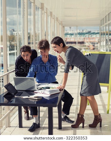 Feeling exhausted and business problem. Frustrated young business people team looking on laptop at working place in office