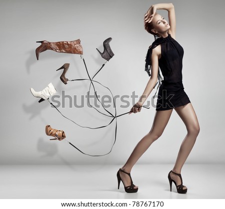 Young woman with many shoes
