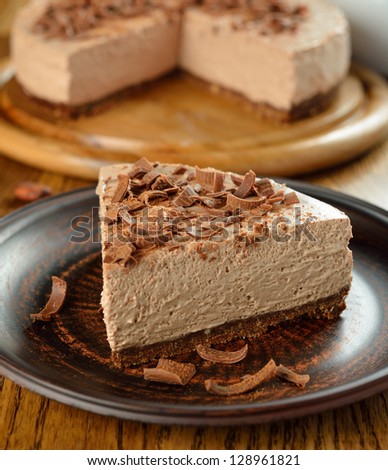Cold chocolate cheesecake on brown plate