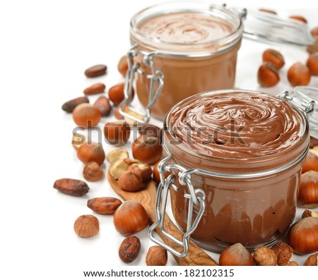 Chocolate paste in a glass jar on a white background