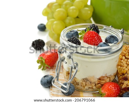 Diet dessert of yogurt and berries on a white background