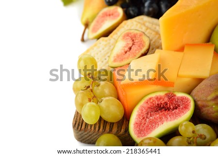 Cheese and fruit on a white background