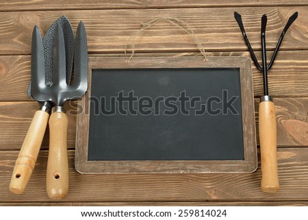 Garden tools on brown background