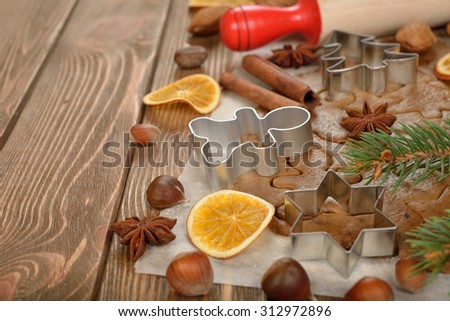 Ingredients for baking Christmas cookies on a brown background