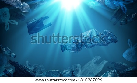 creative background of PET plastic bottles and single-use plastic bags floating in sea or ocean with rays of sunlight effect, polyethylene terephthalate plastic, concept of environmental pollution.