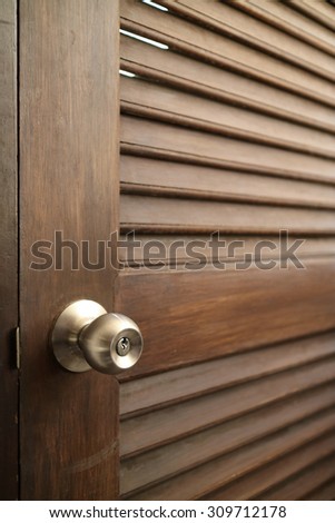 wooden door with grill