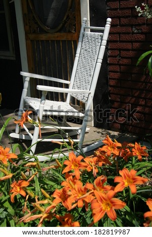 rocking chair on front porch of old house