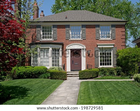 brick house and front lawn