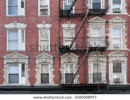 Similar – Foto Bild Fensterln- und Feuerleiterln in Manhattan