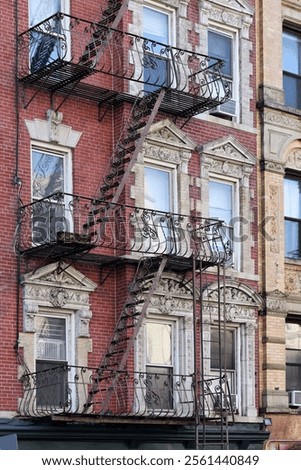 Similar – Foto Bild Fensterln- und Feuerleiterln in Manhattan