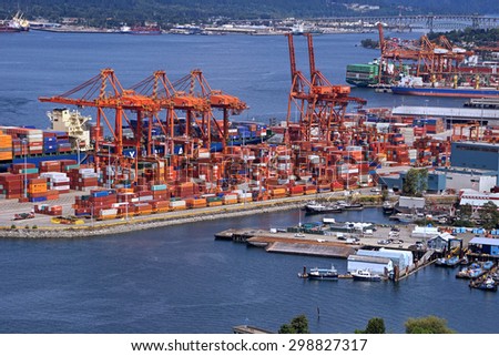 VANCOUVER - JULY 2015:   Gantry cranes at Canada\'s main port for importing goods from Asia in containers and shipping them across the continent by rail as seen in Vancouver in July 2015.