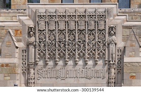 NEW HAVEN, CT - JULY 2015:  A medieval style stone frieze on the exterior of a building depicts the history of Yale University as seen in New Haven in July 2015.