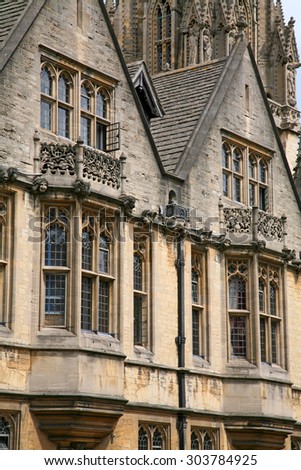 Oxford gothic college building, bay windows overlooking street