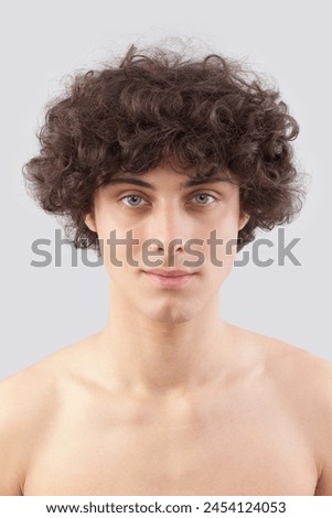 Similar – Image, Stock Photo Smiling curly haired man listening to music in headphones