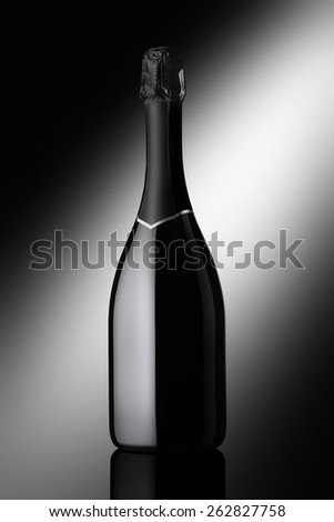 bottle of sparkling wine on a black background