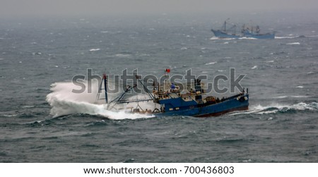 Similar – Boats on small part of seashore washing by foamy waves