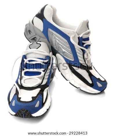 A pair of running shoes, all logos and markings removed. Studio shot on white, not isolated