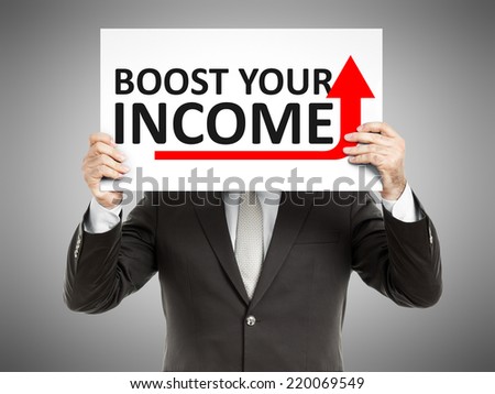 A business man holding a paper in front of his face with the text boost your income