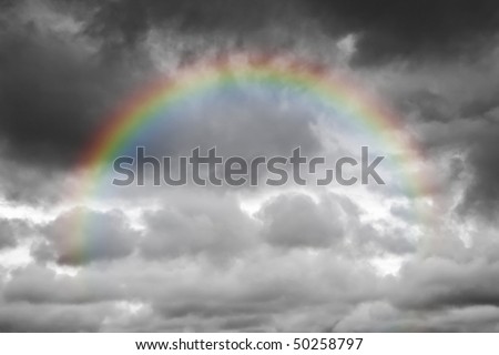 A photography of a dark sky background with a colorful rainbow