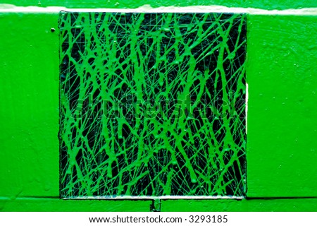 green shapes on black textured background