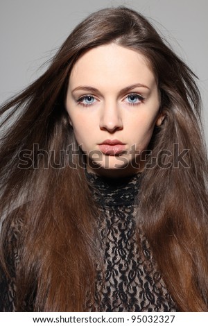 Portrait of beautiful female girl with big blue eyes and big lips, looking sexy