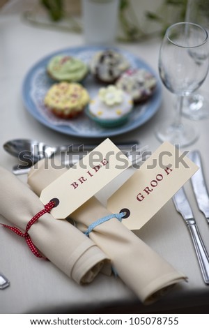 table setting for the bride and groom at a wedding meal