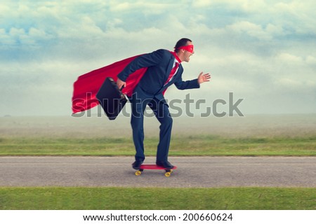 superhero businessman riding a skateboard making progress