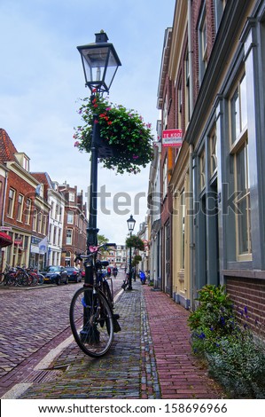 URECHT, THE NETHERLANDS - OCTOBER 5, 2013: Bicycle near the lamp post on Lange Smeestraat on October 5, 2013 in Utrecht, The Netherlands.