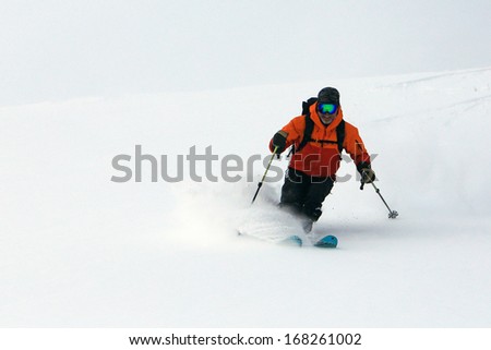 Rugged man skiing fresh powder snow, Utah, USA.