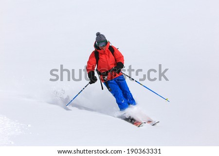 Smiling woman skiing in the Utah mountains, USA.