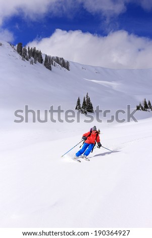 Woman skiing in the Utah mountains, USA.
