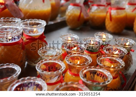 Bottles of wishing candles in kek lok si temple in Penang, Malaysia