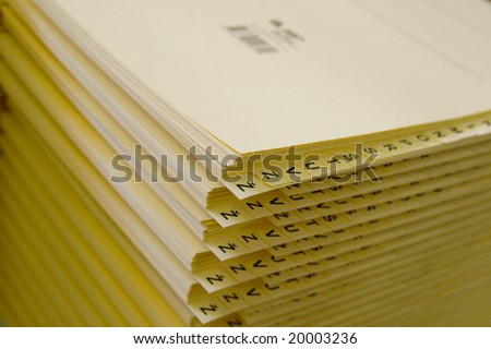 Stack of papers in alphabetical order.