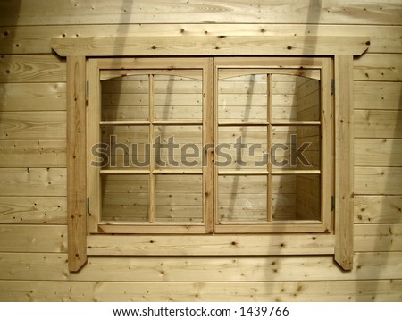 Window in a natural wood cabin
