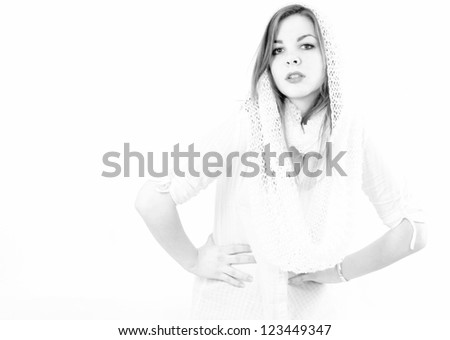 ecstatic fashion girl with scarf over her head,with long hair, hands on hips standing, posing and looking forward