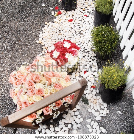bouquet of roses against wooden toy car wedding decoration