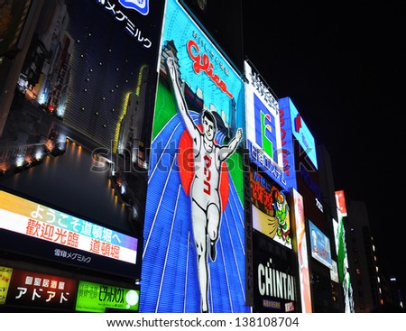 OSAKA, JAPAN - OCT 23: The Glico Man Running billboard and other neon displays on October 23, 2010 in Dotonbori, Osaka, Japan. Dotonbori has many shops, restaurants and colorful billboards.