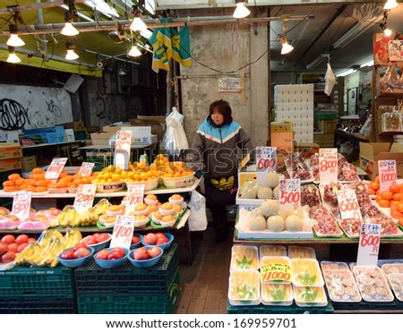 TOKYO, JAPAN- NOVEMBER 22, 2013: Ameyoko is market street,which sell various products, fruit, dried food and spices. Market located in Taito Ward of Tokyo, Japan, November 22 2013