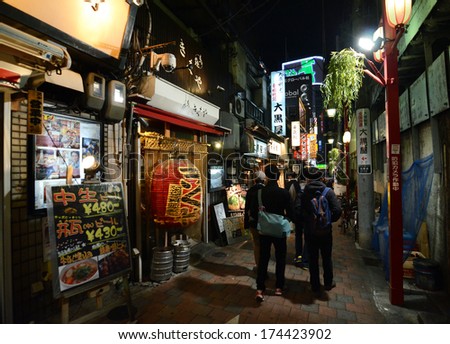 TOKYO,JAPAN - NOVEMBER 23: Yakatori alley(Omoide Yokocho) in the old Shinjuku district in Tokyo, Japan on the night of November 23, 2013. A few traditional restaurants are located here