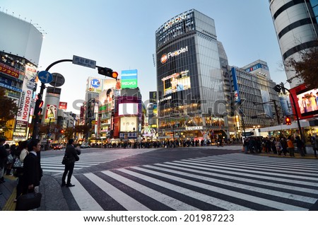 TOKYO - NOVEMBER 28: Crowds of people crossing the center of Shibuya on November 28 2013, the most important commercial center in Tokyo, Japan