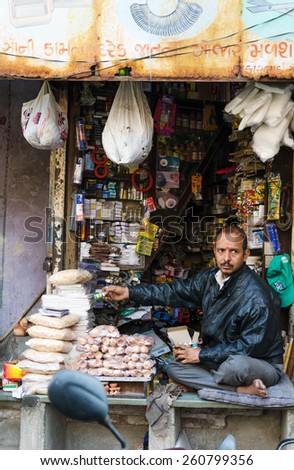 Ahmedabad, India - December 28, 2014: Unidentified Indian man selling variety product at market in Ahmedabad, India. Ahmedabad is the capital city of the western Indian state of Gujarat.