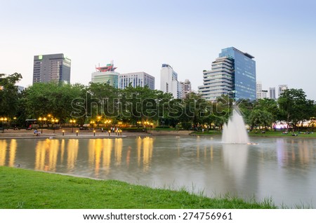 Benjasiri Park with many modern condominiums and business building on the Sukhumvit road in Bangkok, Thailand.