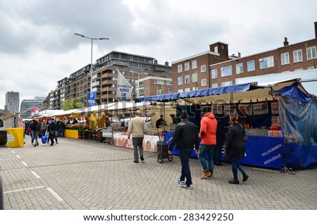 Rotterdam, Netherlands - May 9, 2015: Unidentified shoppers at the Street Market in Rotterdam. A large market is held in Binnenrotte, the biggest market square in the Netherlands.
